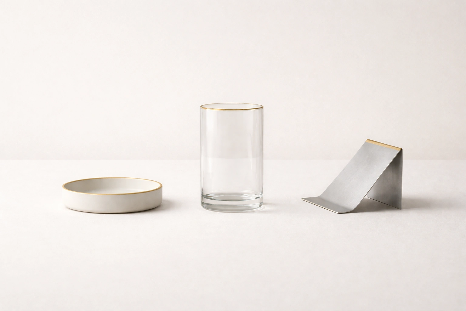 Three formally different objects sharing identical lighting and color treatment, representing consistent ai art direction consistency across Midjourney, FLUX, and DALL-E